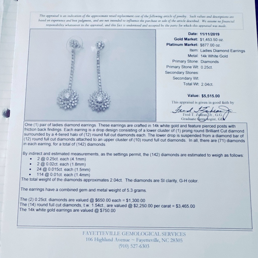 14k white gold and natural diamond drop earrings.